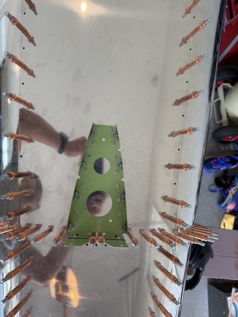 Fabricated vertical stabilizer forward attachment with installed nutplates on the RV-12iS tailcone top skin